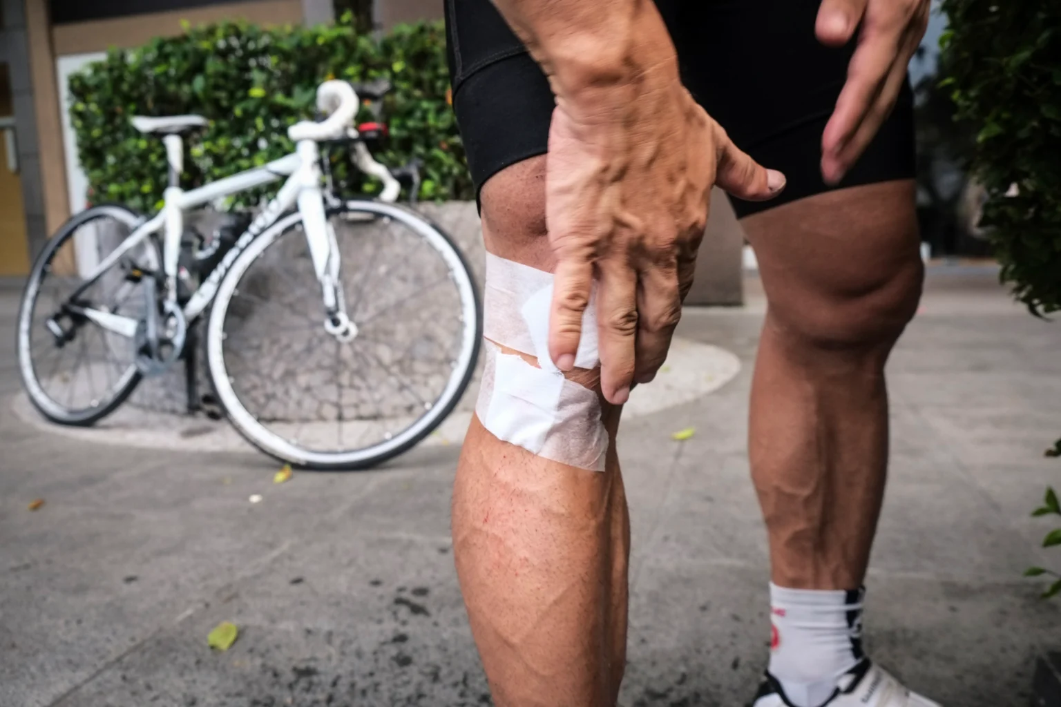 Man touching his knee after sports injury